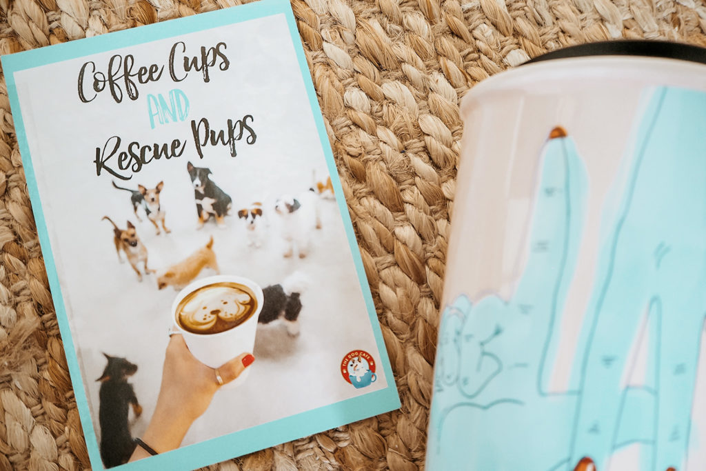 Dog Cafe Los Angeles Flatlay with a flyer and coffee mug